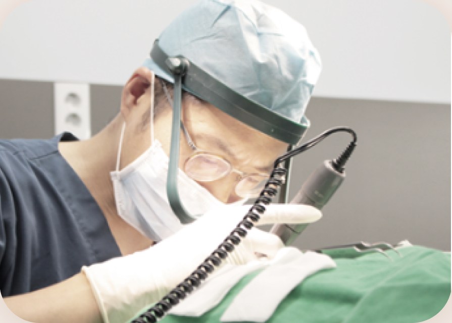 Medical staff wearing loupes while transplanting hairs